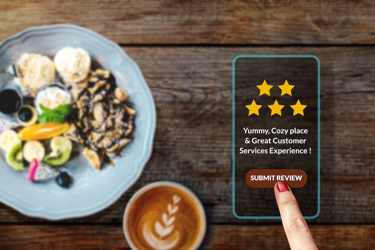 Mozrest - Satisfied customer using her smartphone to post a 5-star review online about her recent experience in a restaurant