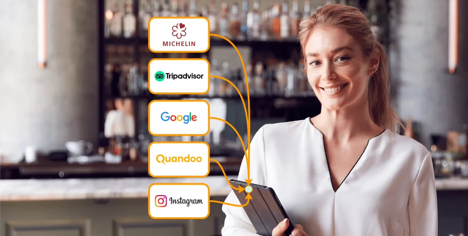 A restaurant manager is standing in her restaurant, smiling at us and holding a tablet that allows her to manage bookings from the MICHELIN Guide, Tripadvisor, Google, Quandoo, Instagram, and more.
