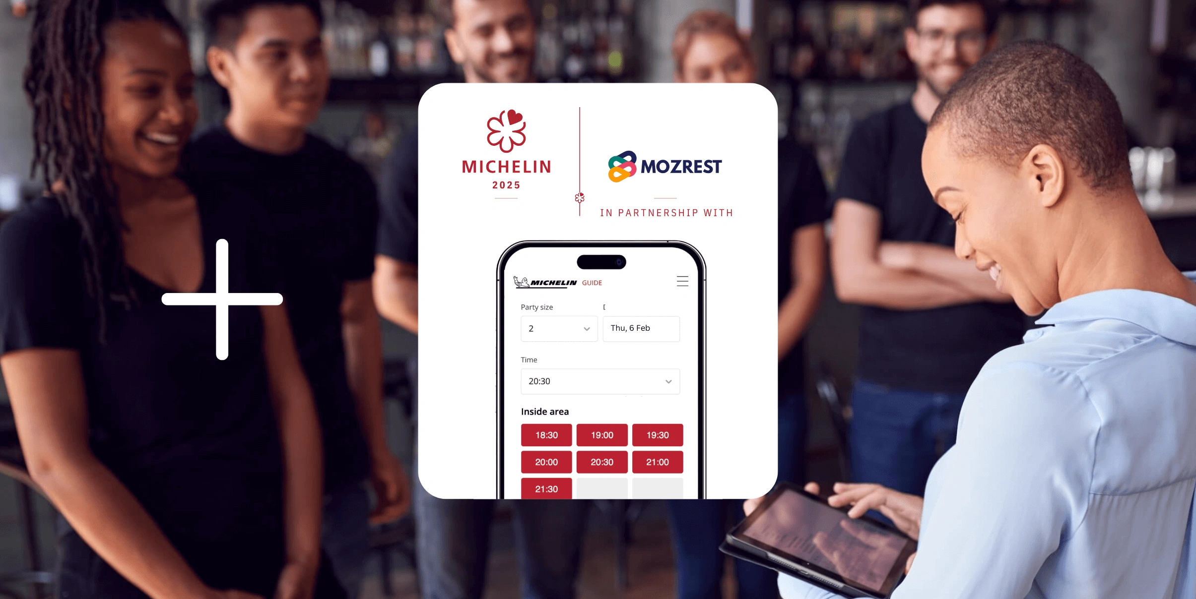 Mozrest - Solutions for Restaurant - Restaurant manager briefing her staff, smiling, and checking the number of today's bookings on her tablet